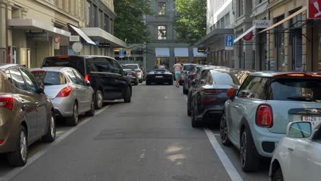 Black-Lamborghini-Aventador-driving-away-in-Zürich,-Switzerland