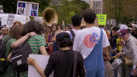 Queens-Park,-Toronto,-Canada---People-are-dancing-with-the-tune-showing-their-positive-support-to-the-Climate-Change-Campaign---Close-up