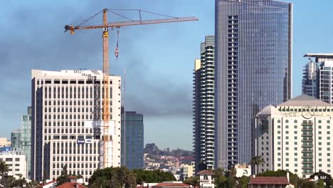 Commercial-aircraft-flying-over-San-Diego-Downtown-in-slow-motion