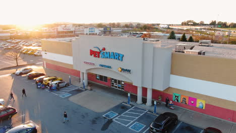 Wide-aerial-dolly-shot,-customers-shopping-at-retail-pet-store,-PetSmart