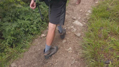 A-Tourist-Hiking-Up-The-Rocky-Mountain-Trail-Of-The-Tatra-Mountains-In-Slovakia---Slow-Motion-Tilt-Down-Shot