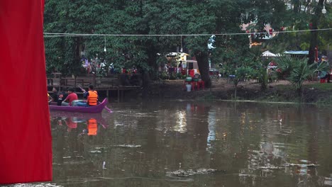 Static-Shot-of-a-Colorful-Purple-Boat-on-the-River