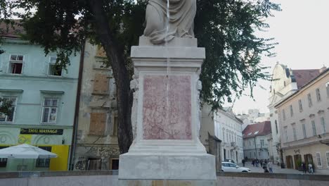 Woman-with-vase--in-Bratislava,-tilt