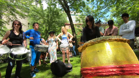 Percussion-performers,-musicians,-band-playing-percussion,-drum-instruments,-rhythm-art,-outside-festival,-tabla,-beat-drummers,-tambourine,-drums-performance