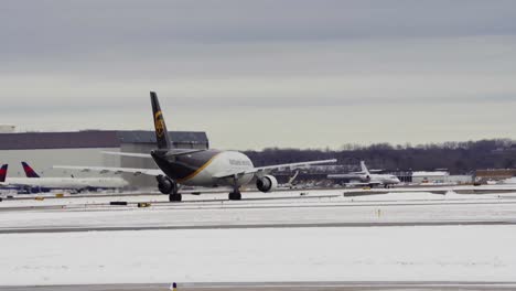 A-UPS-cargo-plane-moves-slowly-along-the-runway-at-Minneapolis−Saint-Paul-International-Airport