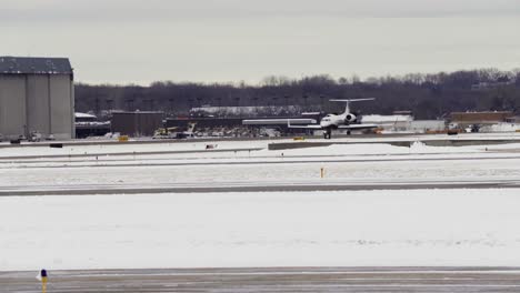 Just-after-landing,-a-small-airplane-slows-down-as-it-moves-along-the-runway-at-Minneapolis−Saint-Paul-International-Airport
