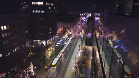 Ljubljana-night-time-lapse,-traffic-on-main-street-with-Christmas-lights