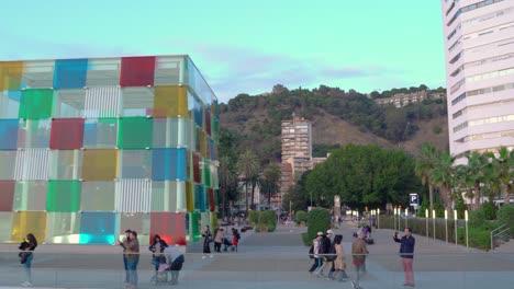 Tourists-gathering-around-Centre-Pompidou-Malaga,-Spain