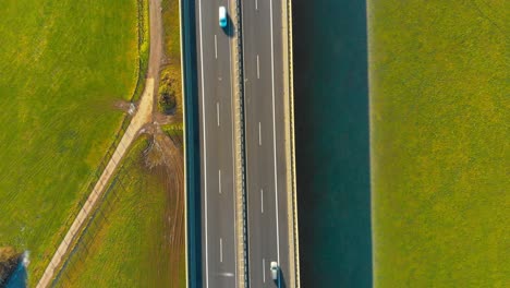 drone-flight-over-a-highway-with-cars-and-trucks-top-view