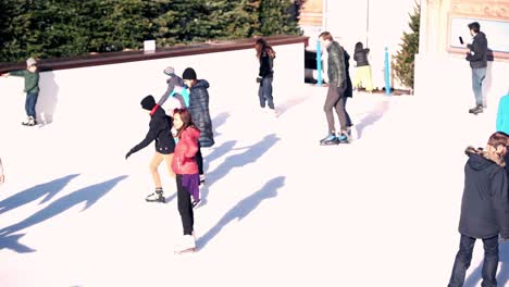 Slow-motion-of-people-ice-skating-in-public