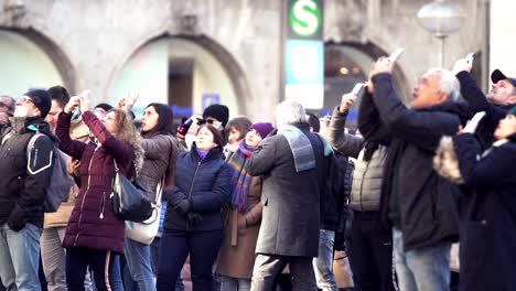 People-Listening-And-Watching-The-Famous-Glockenspiel-At-Munich-Marienplatz