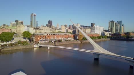 Aerial-dolly-out-of-Puente-de-la-Mujer,-an-iconic-landmark-of-Buenos-Aires