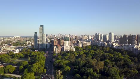 Aerial-lowering-of-beautiful-parks-and-Buenos-Aires-skyline-at-golden-hour