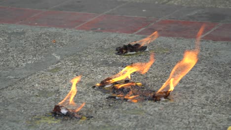 Removing-paint-on-asphalt-with-fire-on-the-street-in-Thailand