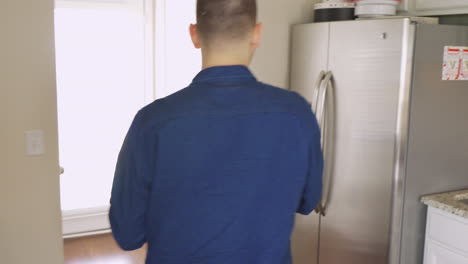 Man-pouring-glass-of-milk