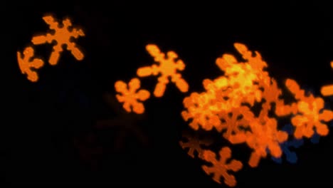 Beautiful-snowflake-shape-bokeh-from-flashing-LED-lights,-Christmas,-winter,-holiday-or-glamour-party-background-concept,-copyspace