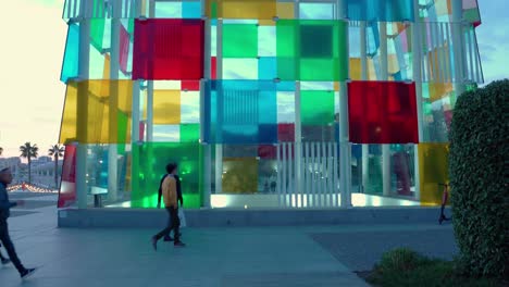 People-walk-by-Centre-Pompidou-Malaga,-Spain