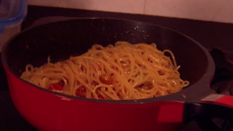 Slow-motion-shot-of-cooking-spaghetti-movement-with-tomato-sauce-in-pot