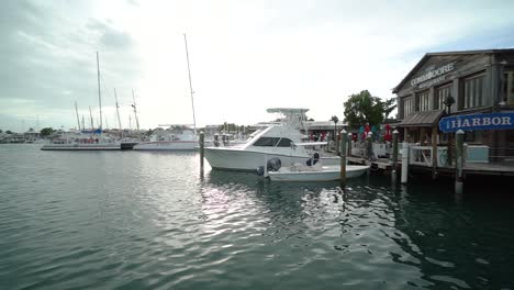 Wide-shot-of-Wooden-Marina-With-Pan-Left-to-Boats-Docked-in-Harbor