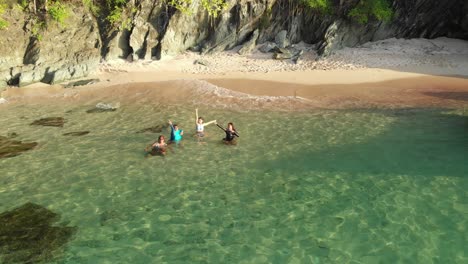 Aerial-view-of-a-tourist-swimming-in-a-secluded-pink-sand-beach-only-accesible-by-boat-on-the-Caribbean-island-of-Tobago