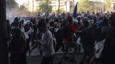 Stampede-of-rioters-flee-in-the-streets-as-they-are-sprayed-with-fire-hoses