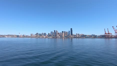 Seattle-city-coastline-panorama-with-skyscrapers-and-port-cranes