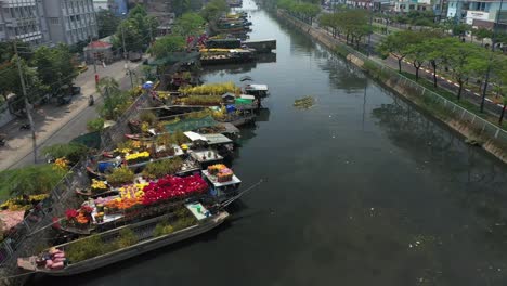 Aerial-view-flying-over-floating-flower-market-in-Saigon-or-Ho-Chi-Minh-City-in-Vietnam