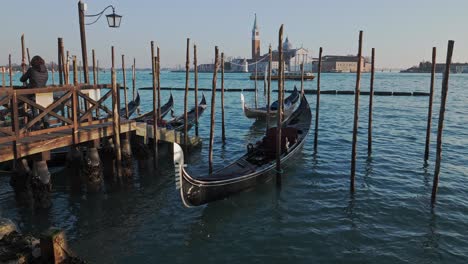 View-at-Island-of-San-Giorgio-Maggiore-and-gondola-in-foreground,-Italy