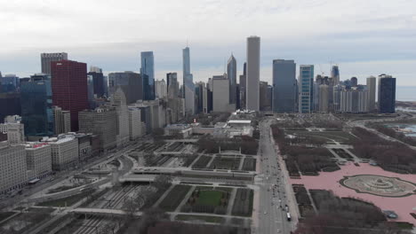 Millennium-Park-and-buildings-of-downtown-aerial-view-in-Autumn,-Buckingham-Fountain-and-Grant-Park,-Chicago,-Illinois,-United-States-of-America