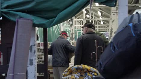 People-purchasing-second-hand-objects-at-flea-market-uk-antique-junk-fair