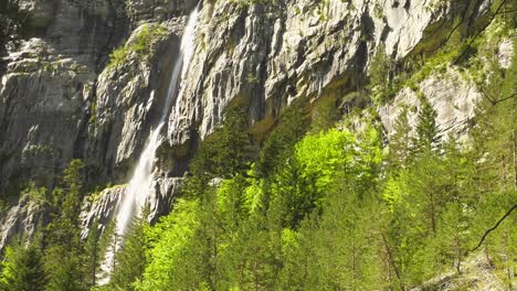 High-mountain-waterfall-on-steep-rock-face