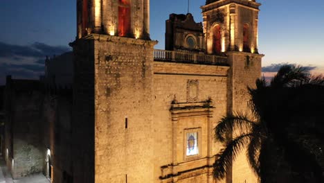 Aerial-ascending-nighttime-extreme-closeup-of-the-towers-of-the-Cathedral-de-San-Gervasio-in-Valladolid,-Yucatan,-Mexico