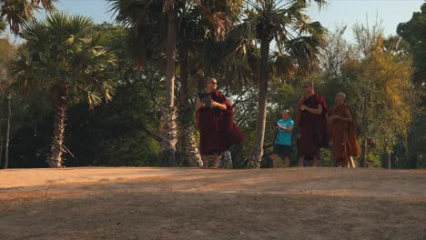 Medium-Shot-of-Monk-Getting-Ready-to-Get-a-Picture