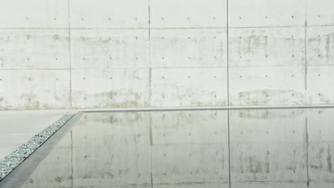 Concrete-walls-reflecting-in-calm-water