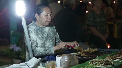 Street-Vendor-Selling-Differnt-Kind-of-Local-Barbecue-Skewers-at-Night-Market