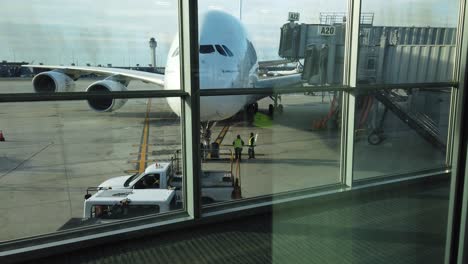 Huge-Emirates-Airline-plane-parked-at-its-gate-at-Dulles-International-Airport-near-Washington,-DC