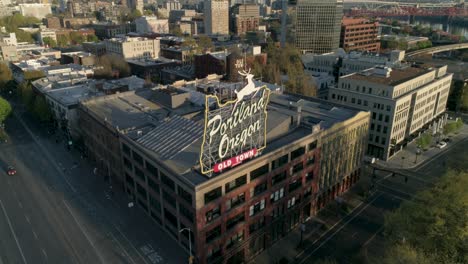 Historic-aerial-of-Portland,-Oregon's-iconic-Old-Town-sign-with-empty-streets-due-to-COVID-19