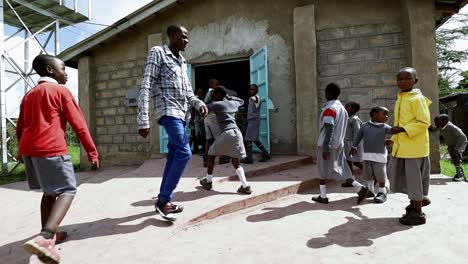 Primary-school-children-file-into-a-church-building-on-the-campus-of-their-private-school-near-Nairobi,-Kenya