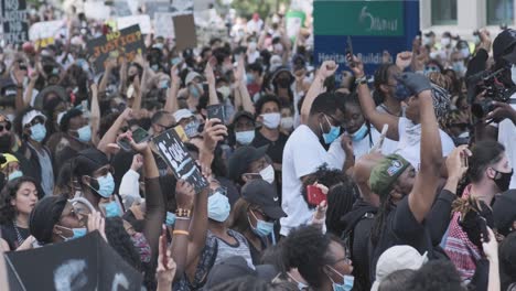 Panning-shot-of-a-wide-crowd-of-protesters-in-Ottawa,-following-the-death-of-George-Floyd