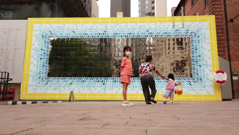 Locals-pass-by-Contemporary-art-on-display-in-Hong-Kong-HKMOA-compound