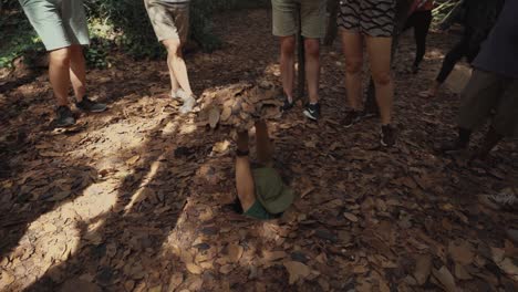 Vietnamese-Male-Guide-Demonstrating-How-to-Hide-in-a-Tunnel