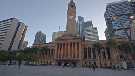 tourists-and-local-commuters-passing-by-Brisbane-city-hall-at-King-George-Square