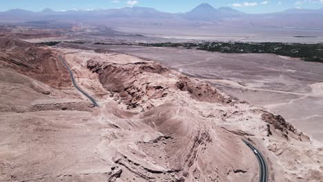 Aerial-Drone-above-Atacama-Desert,-Plateau-Andean-Mountains-and-Road-in-Chile,-South-America,-Infinite-Sand-Landscape