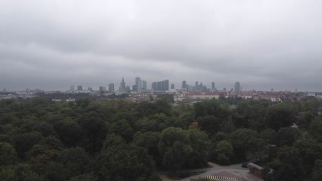 Beautiful-drone-footage-of-warsaw-city-skyline-with-skyscrapers-with-forest