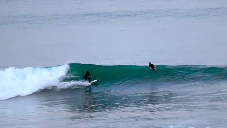 a-surfer-catches-Florissant-blue-wave-in-California