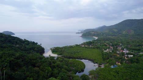 Aerial-view-approaching-the-Barra-Do-Sahy-beach-and-town,-in-Costa-Verde,-Brazil