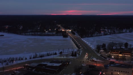 Aerial,-Clark-Street-Bridge-in-downtown-Stevens-Point-Wisconsin-in-the-evening-during-winter