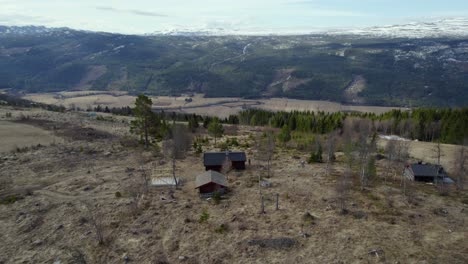 Aerial-view-towards-a-cabin-in-the-remote-wilderness-of-central-Norway