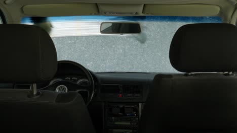 Washing-Car-Windshield-With-Foam-Brush-In-Self-Service-Car-Wash