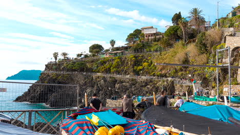 Time-lapse-of-tourists-walking-along-the-Manarola-cliffside-hiking-trail-on-a-warm-summer-day